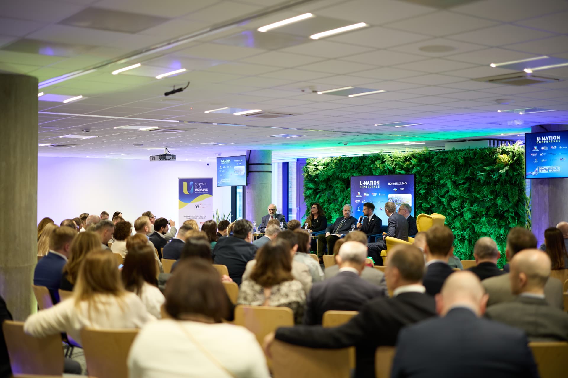 Audience and panel at the U-Nation Conference in Warsaw